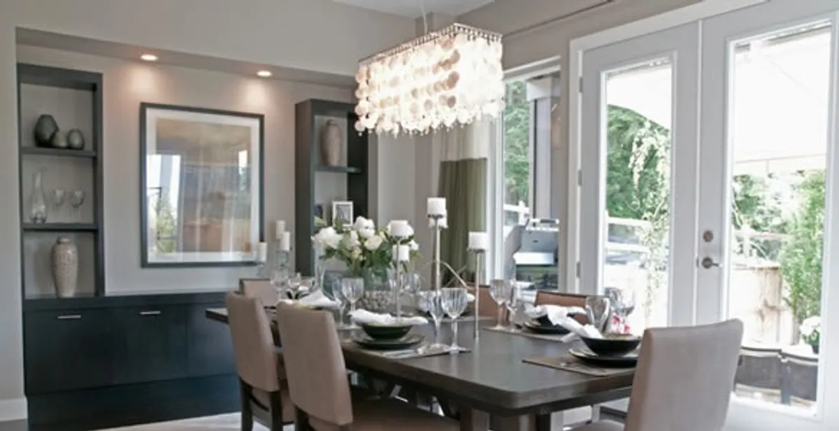 Elegant dining room chandelier installation above table in Columbia, SC