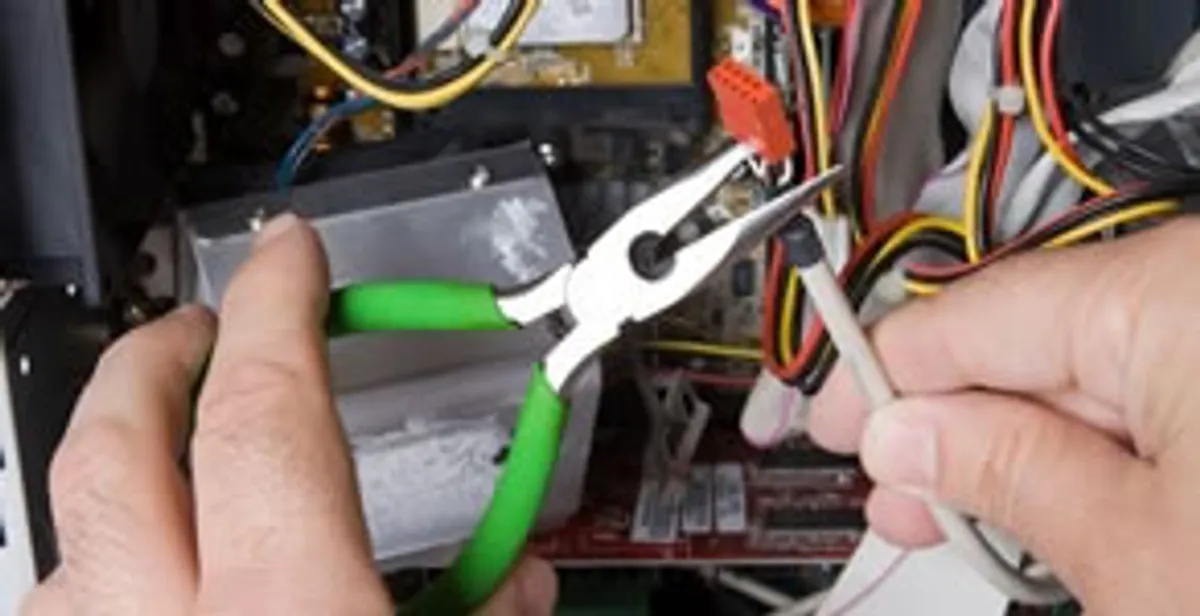 Licensed electrical contractor performing electrical repair with tools in Irmo, SC